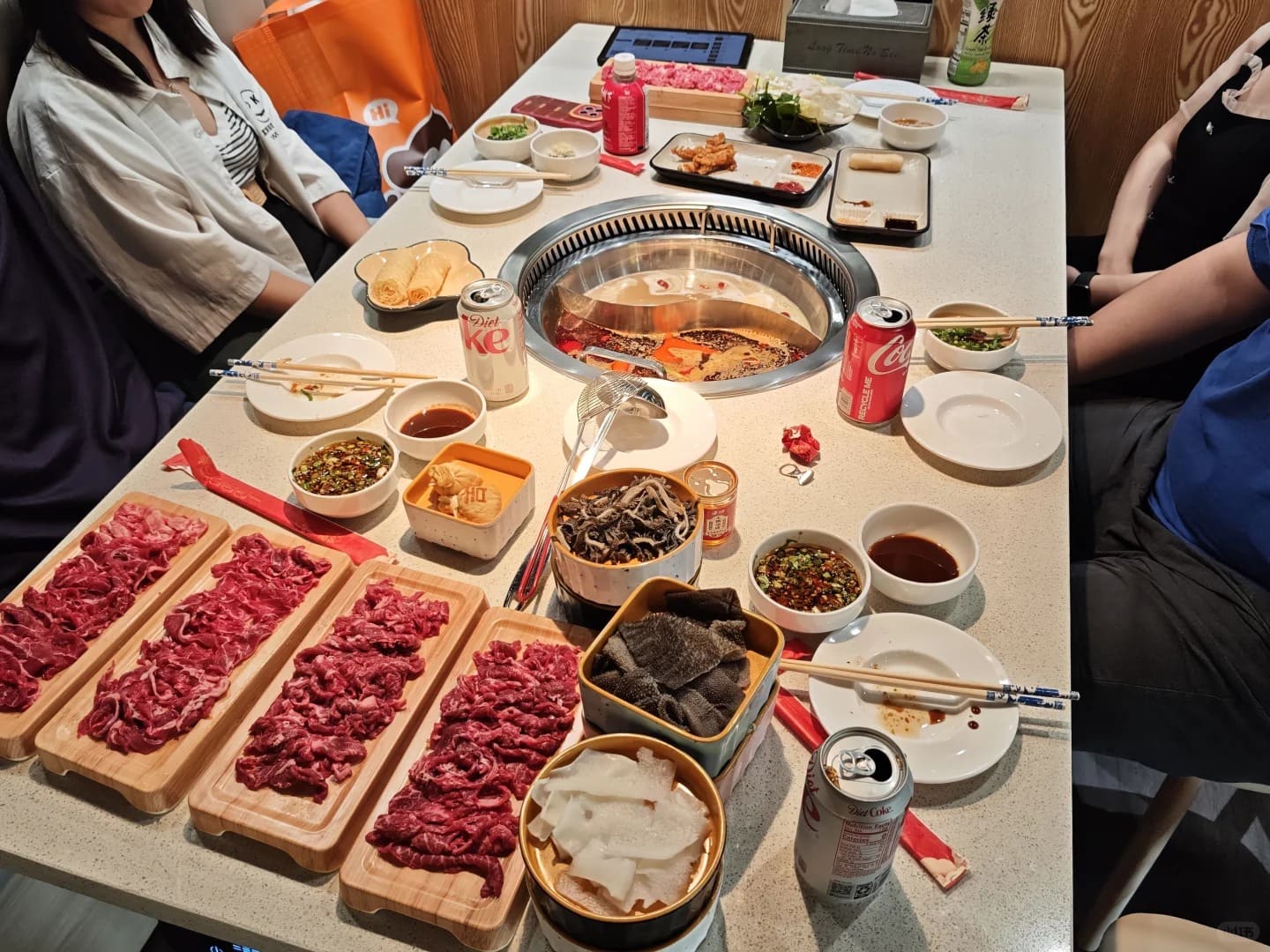 Friends sharing a Sichuan hot pot meal