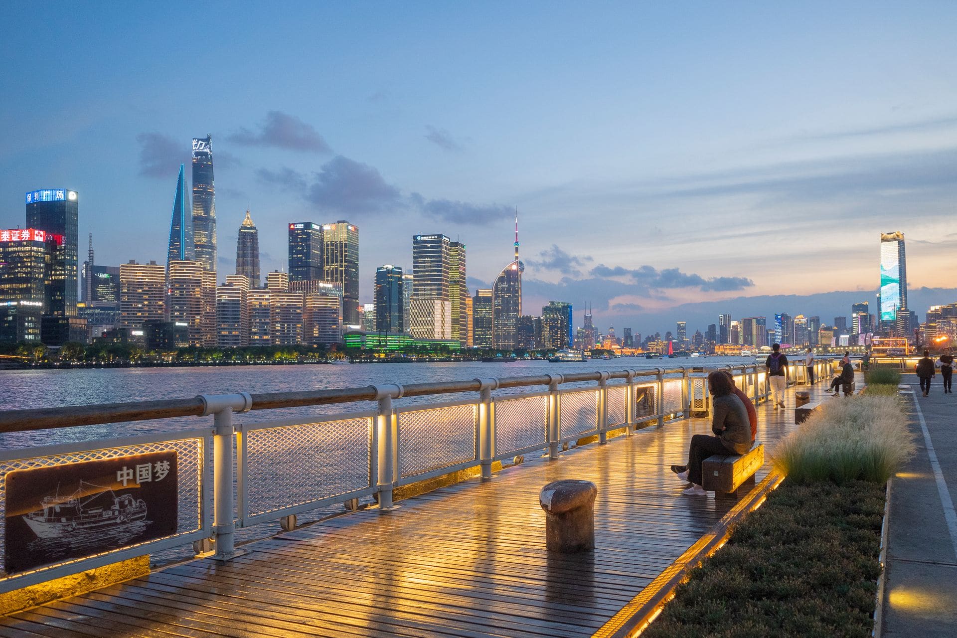 Crowds of visitors on the Bund promenade at night