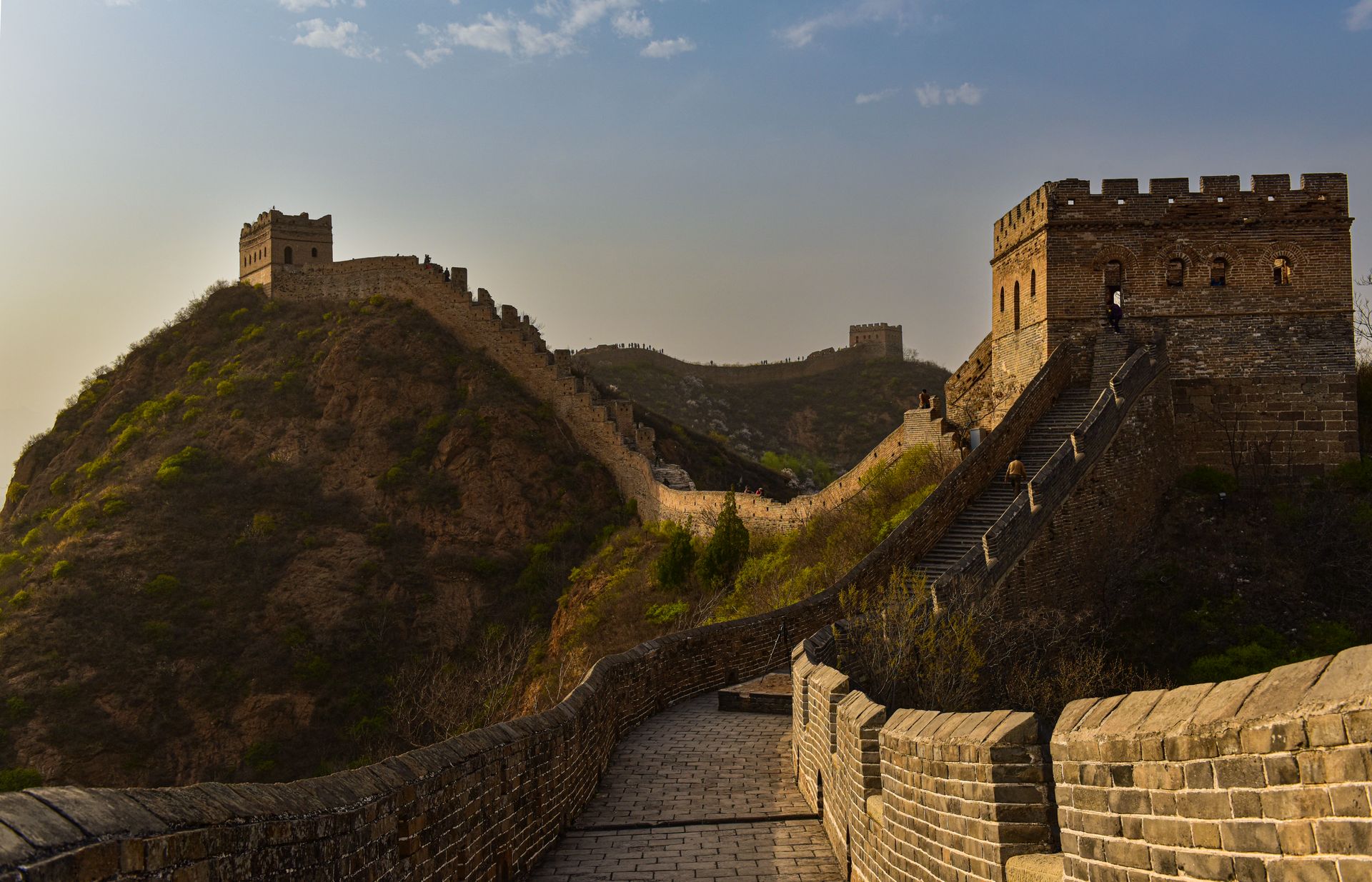 Travellers hiking the Great Wall at sunrise