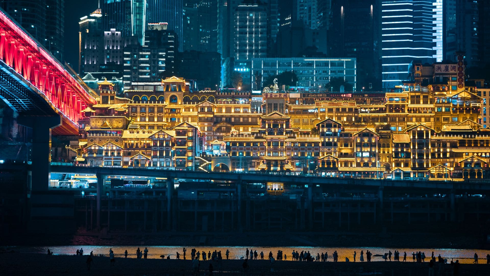 Chongqing skyline lit up at night along the river